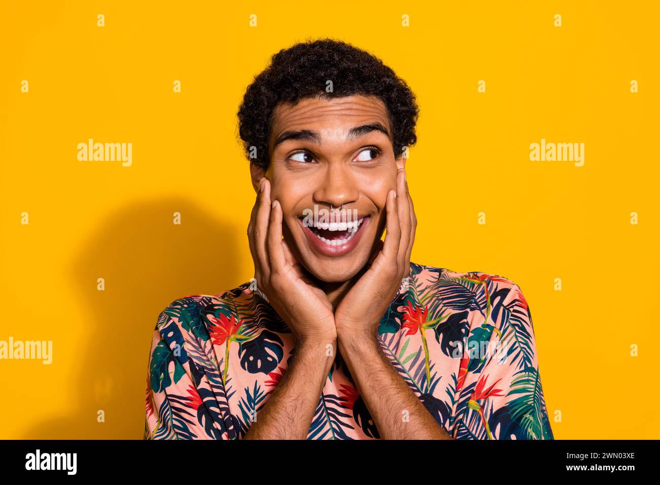 Photo of surprised guy touch cheeks looking empty space desirable tour ...