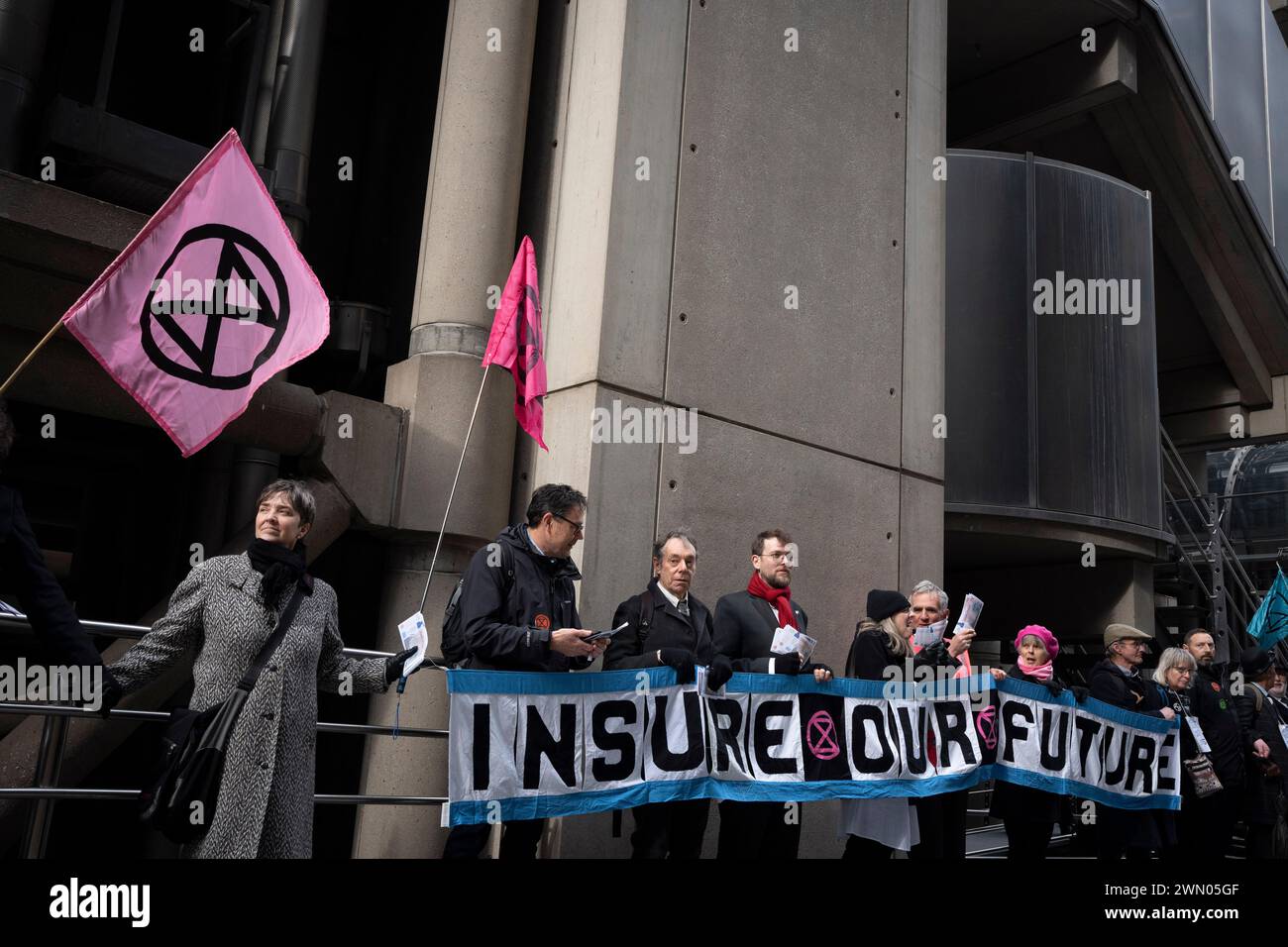 Climate change campaigners with Extinction Rebellion protest outside city underwriting institution, Lloyds of London in the City of London, the capital's financial district, on 28th February 2024, in London, England. Stock Photo