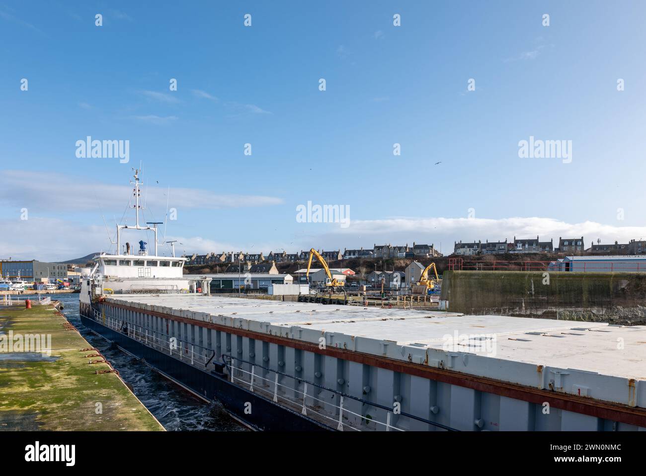 27 February 2024. Buckie Harbour,Buckie,Moray,Scotland. This is the MV Victress departing from Buckie Harbour loaded with over 2 thousand tonnes of se Stock Photo