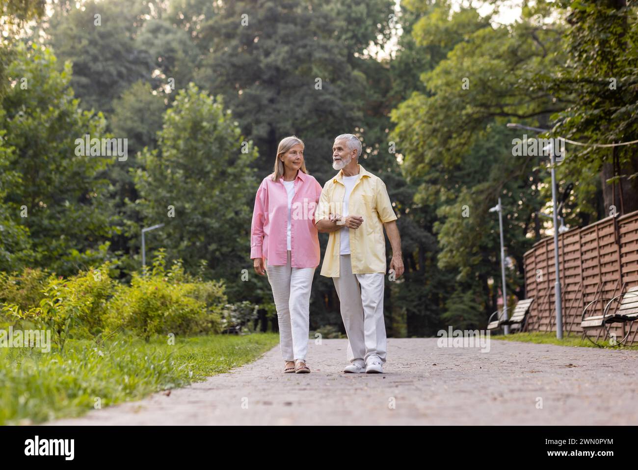 Elderly couple strolls hand in hi-res stock photography and images - Alamy