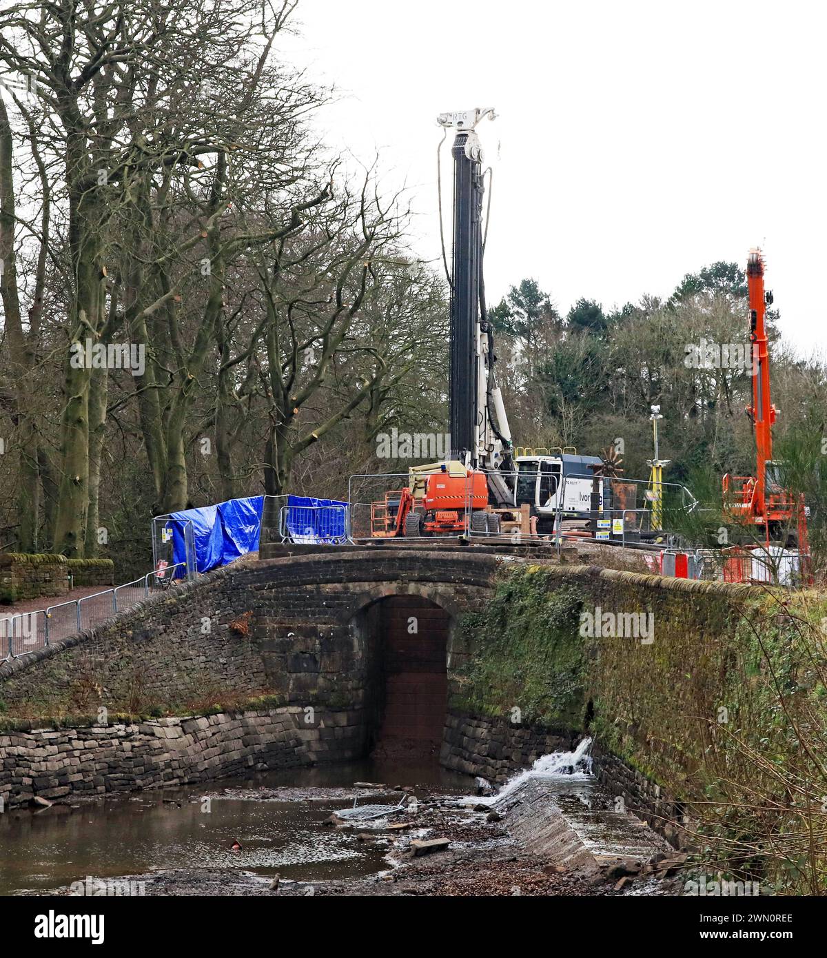Heavy machinery on lock 7 of the Peak Forest canal as repairs to the lock are underway on the Marple flight of locks on the 27th of February 2024 Stock Photo