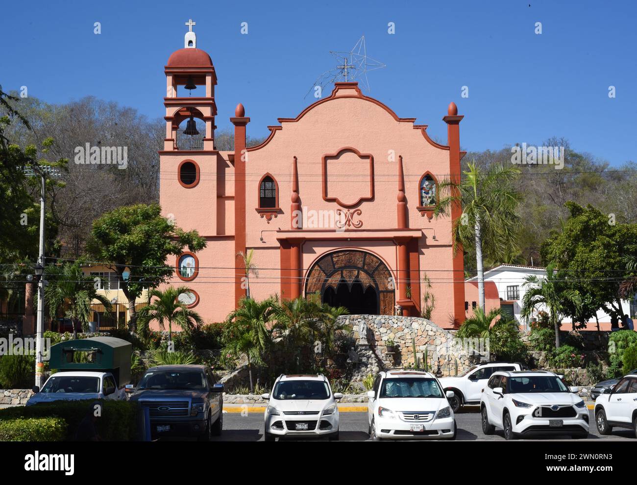 The Cathedral church and parked cars in Huatulco, Oaxaca, Mexico Stock