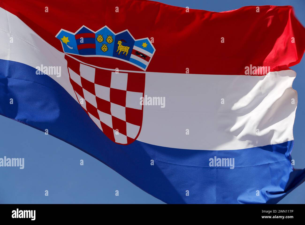 Croatia flag waving in the wind blue sky on background Stock Photo Alamy