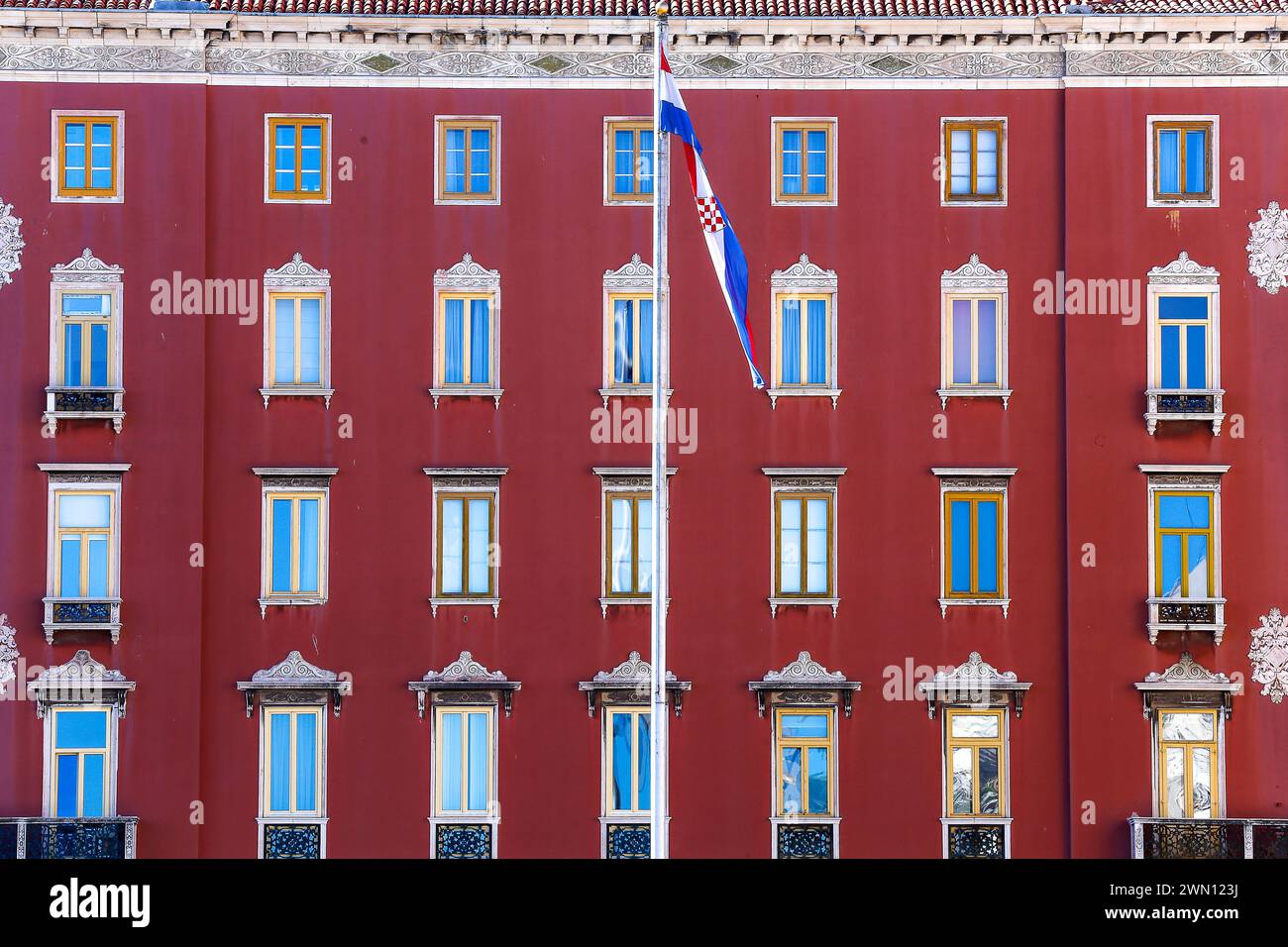 Windows with colorful reflections in the Bajamonti Palace, also known as Casa Deskovic on the city center promenade. Split, Croatia Stock Photo