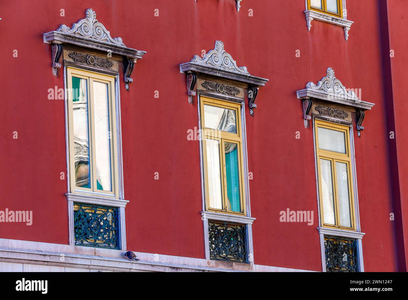 Windows with colorful reflections in the Bajamonti Palace, also known as Casa Deskovic on the city center promenade. Split, Croatia Stock Photo