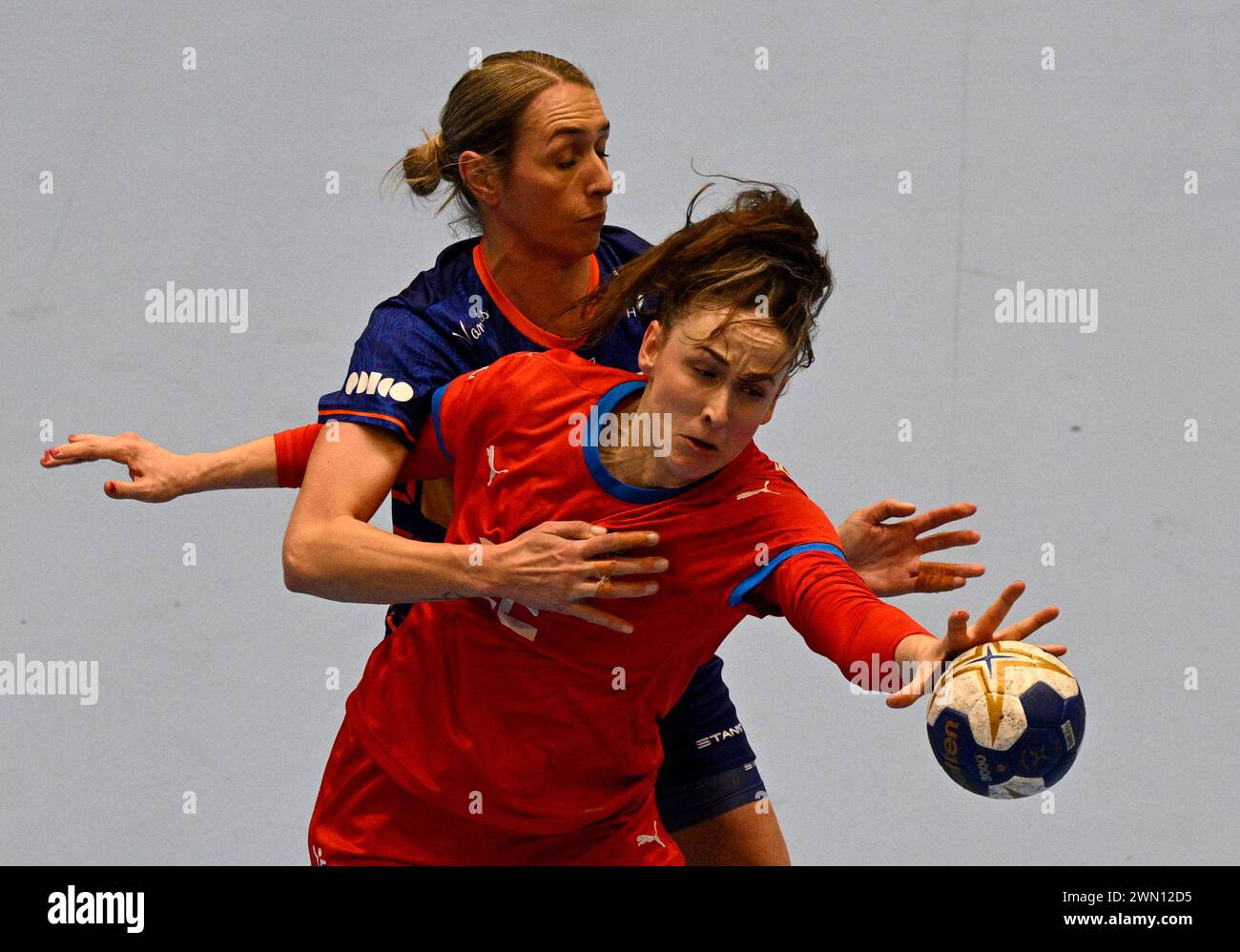 Prague, Czech Republic. 28th Feb, 2024. Lois Abbingh of Netherlands, left, and Marketa Sustackova of Czech Republic in action during women's European handball championship 2024 qualification match Czech Republic vs Netherlands in Prague, Czech Republic, February 28, 2024. Credit: Michal Krumphanzl/CTK Photo/Alamy Live News Stock Photo