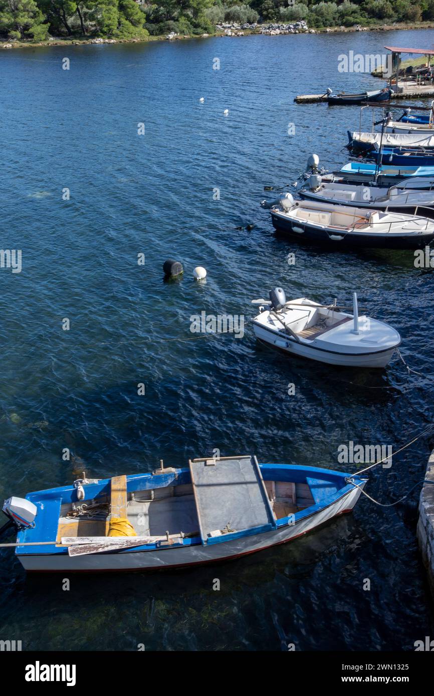 blue and white fishing boats over dark water. Ston, Croatia Stock Photo ...