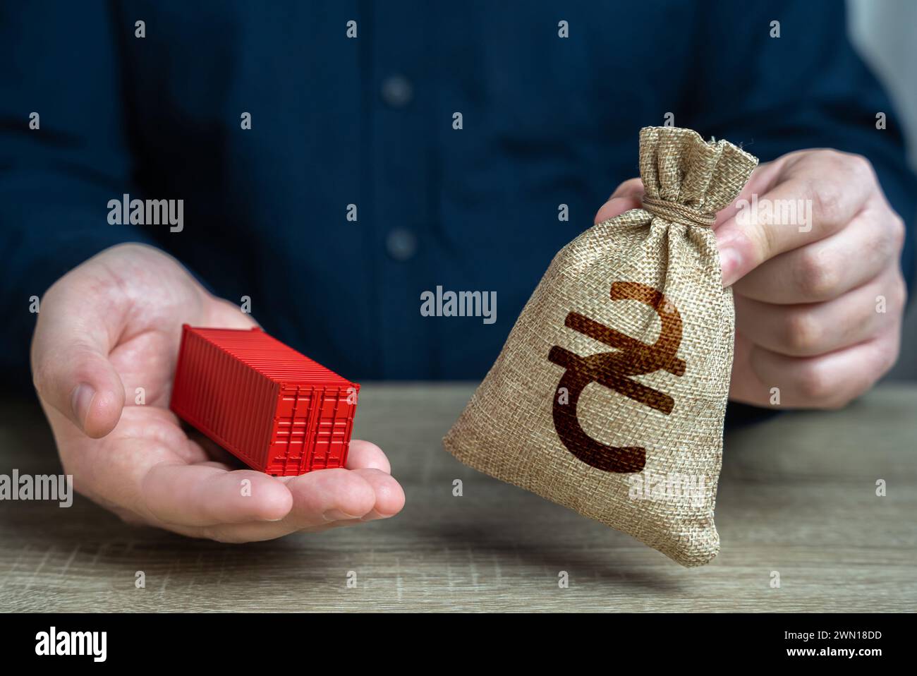 Ship container and ukrainian hryvnia money bag. Trade and delivery ...