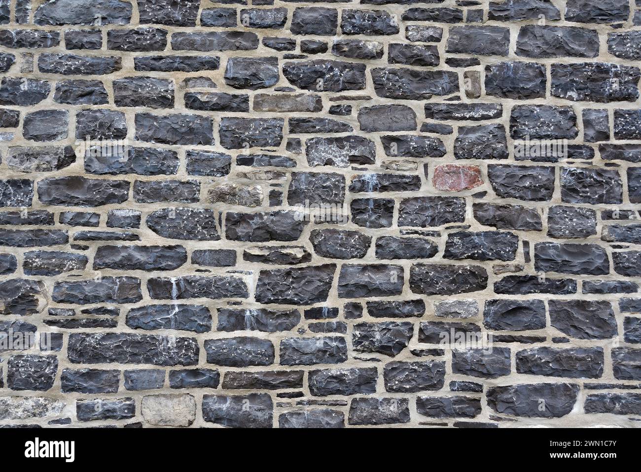 Natural stone wall background in grey tone Stock Photo - Alamy