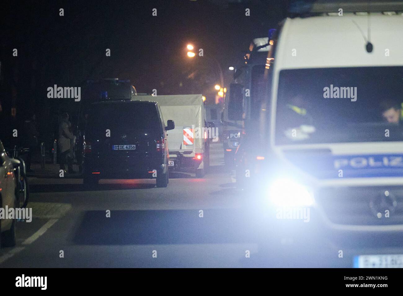 Berlin, Germany. 28th Feb, 2024. A police vehicle with a special trailer (gray) for the removal of a dangerous object drives into Sebastianstraße. Two days after the arrest of former RAF terrorist Daniela Klette, the case continues to keep the capital on tenterhooks: the removal of dangerous weapons from the home of former RAF terrorist Daniela Klette in Berlin-Kreuzberg dragged on for many hours into the night on Thursday. Credit: Annette Riedl/dpa/Alamy Live News Stock Photo