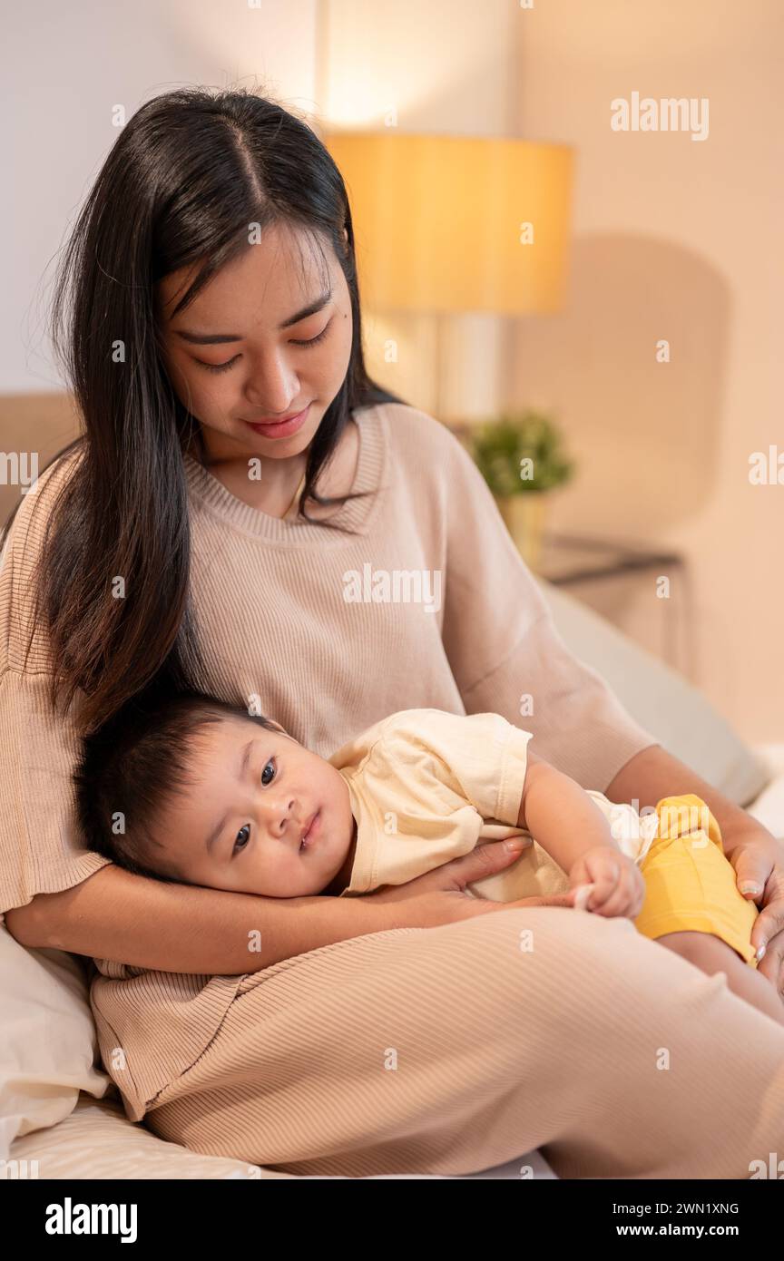 Putting a child to bed hi-res stock photography and images - Alamy