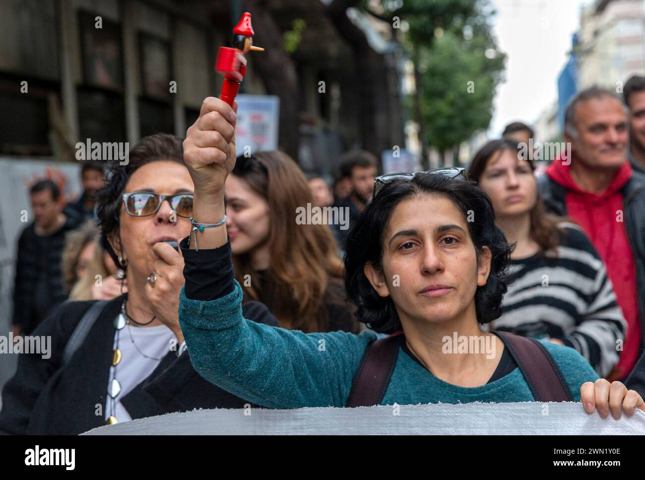(240229) -- ATHENS, Feb. 29, 2024 (Xinhua) -- Protestors march to mark the first anniversary of the country's deadliest-ever train crash in Athens, Greece, Feb. 28, 2024. Greece was hit by a 24-hour nationwide strike on Wednesday, paralyzing public services including transport and hospitals. The trade union-led strikes were called to protest low salaries amid high living costs. In central Athens, around 20,000 protestors marched on Wednesday to mark the first anniversary of the country's deadliest-ever train crash, which happened one year ago in the valley of Tempi. Several masked young p Stock Photo