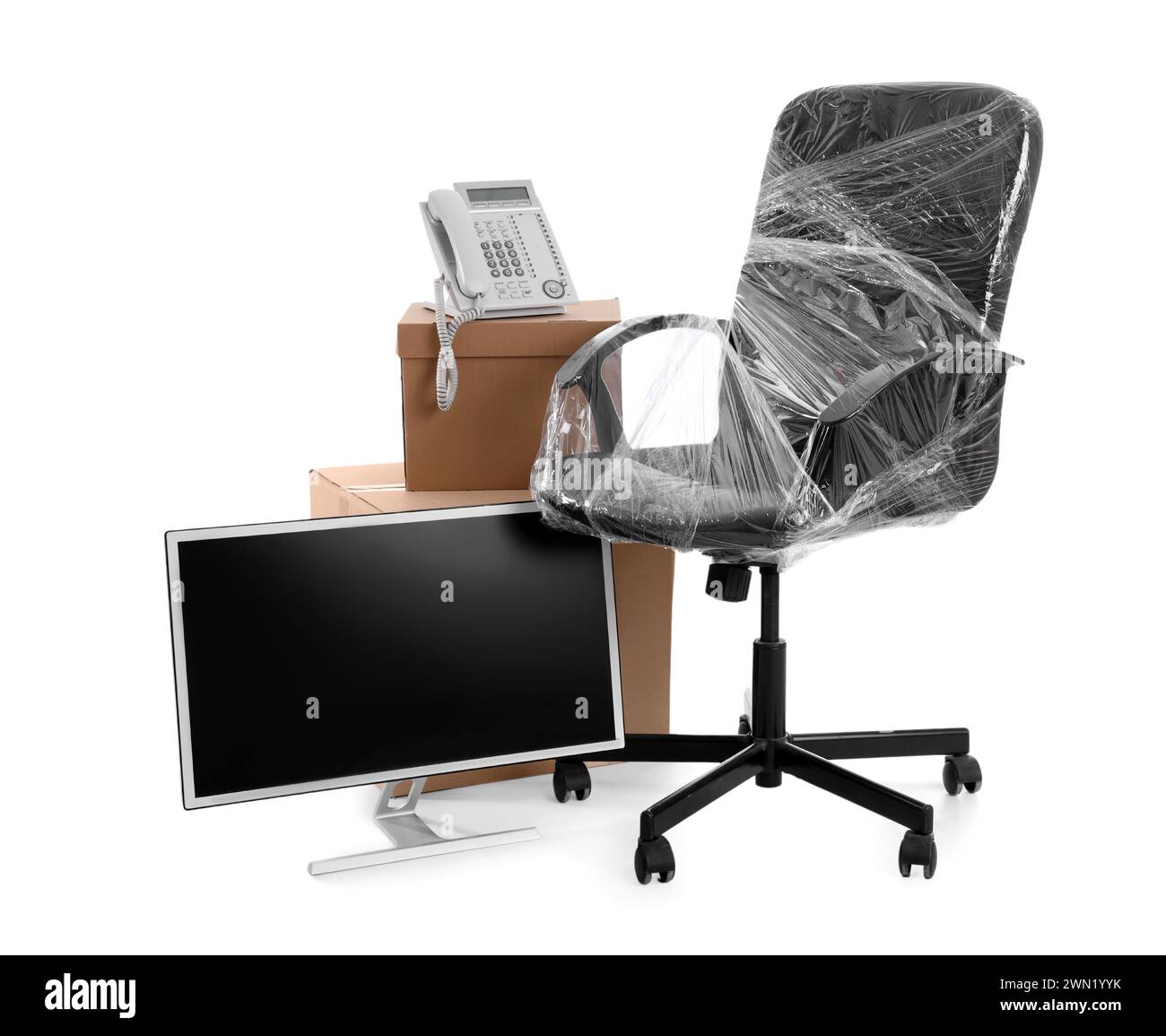 Chair wrapped in stretch film, PC monitor and cardboard boxes on white background. Office moving day concept Stock Photo