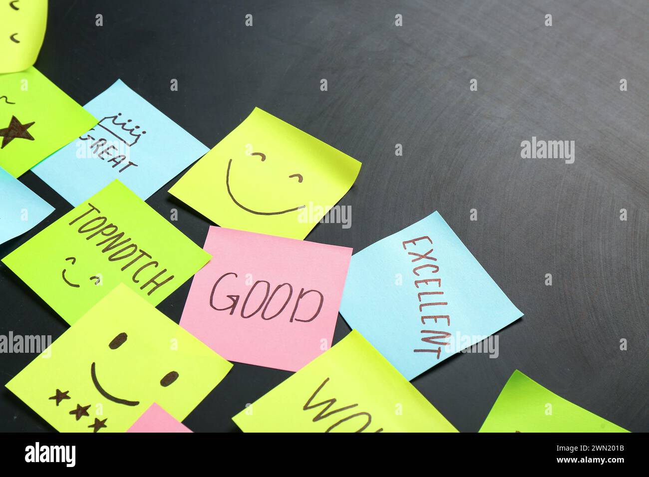 Sticky papers with reviews on dark background, closeup. Customer ...