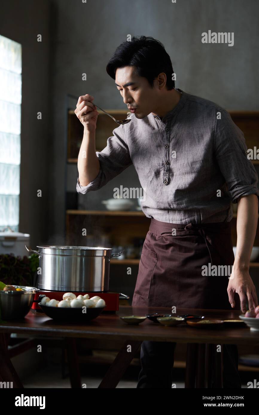 Cook making dishes in the kitchen Stock Photo