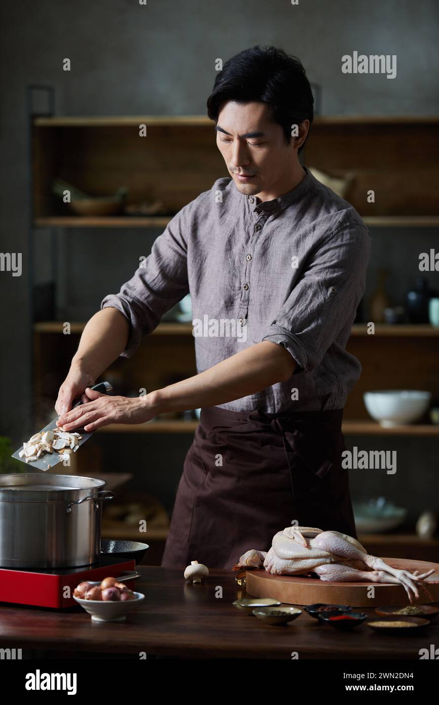 Cook making dishes in the kitchen Stock Photo