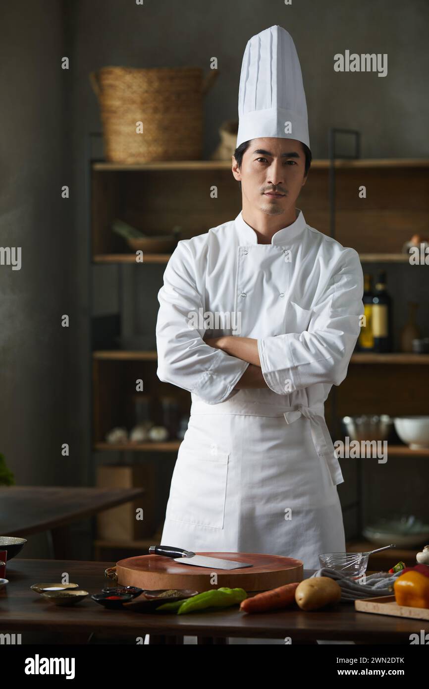 Cook making dishes in the kitchen Stock Photo