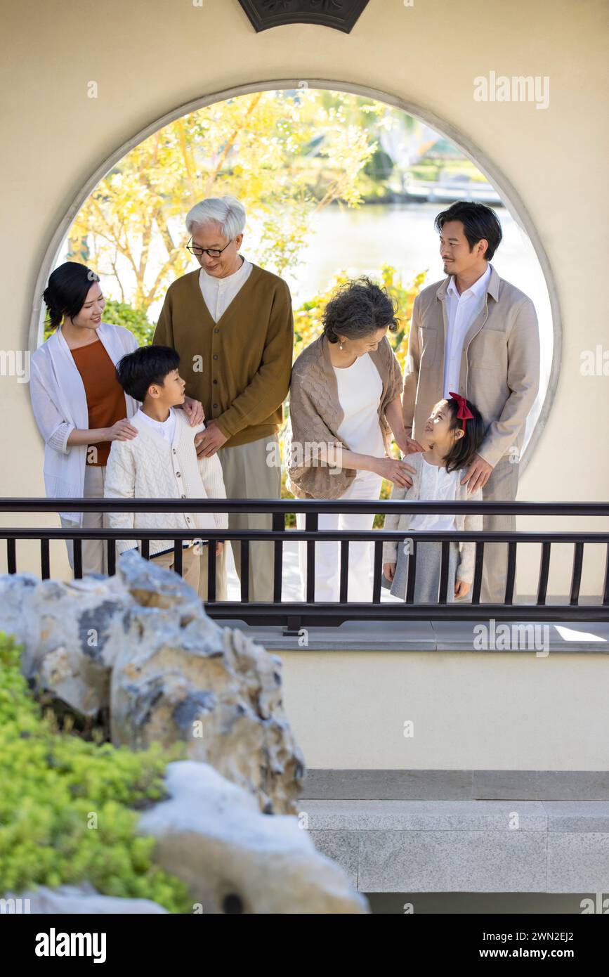 Happy Family Visiting Classical Garden Stock Photo