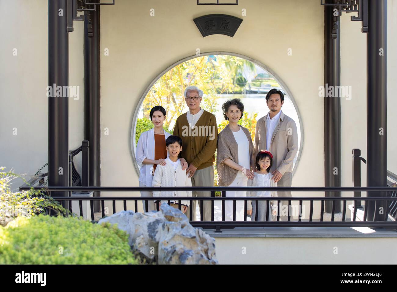 Happy Family Visiting Classical Garden Stock Photo