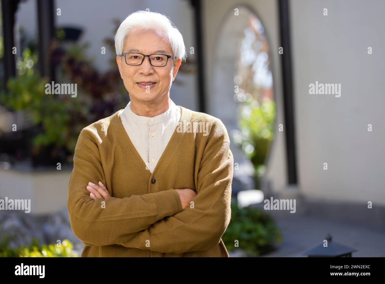 Senior Man in Classical Garden Stock Photo