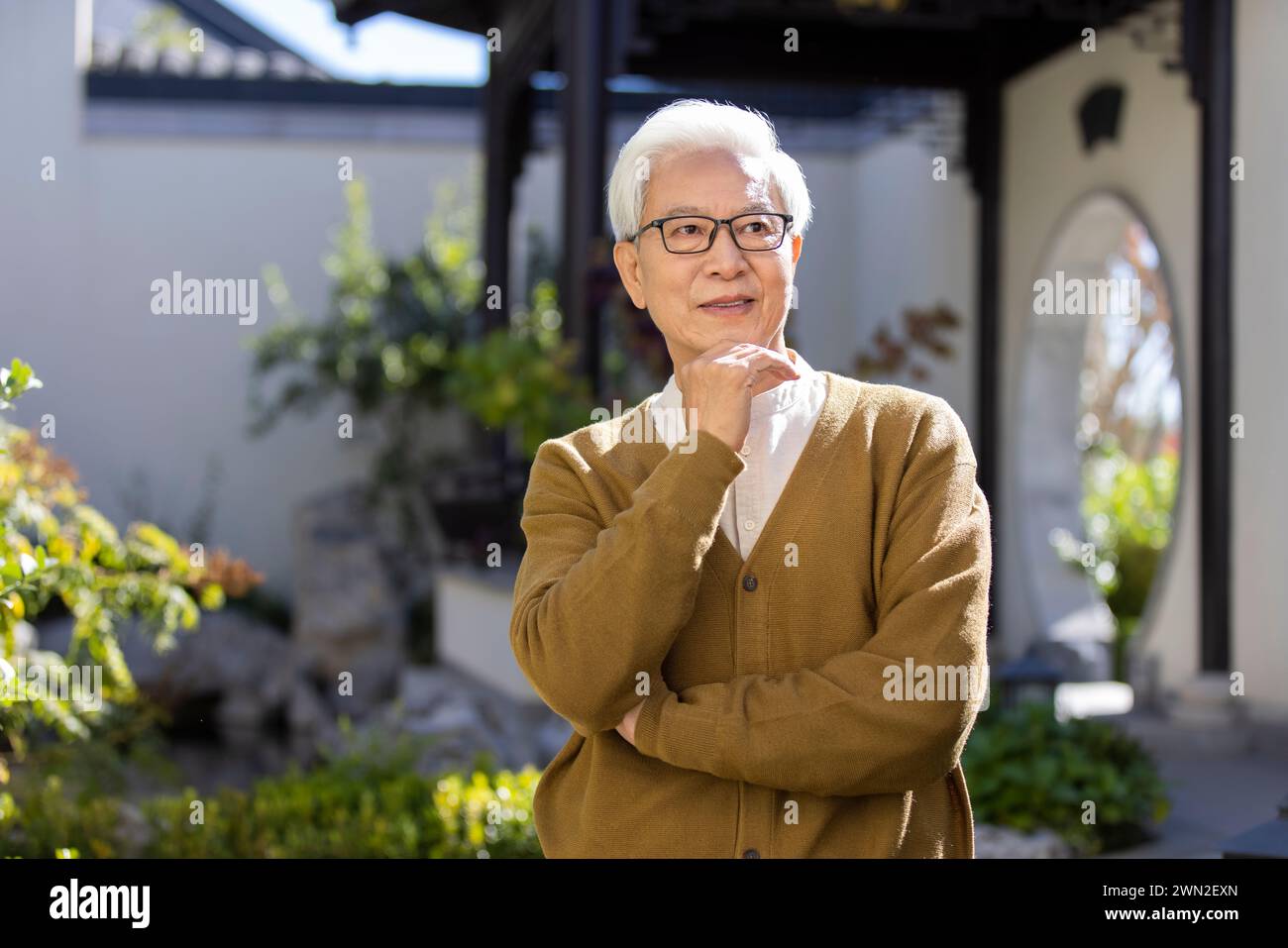 Senior Man in Classical Garden Stock Photo
