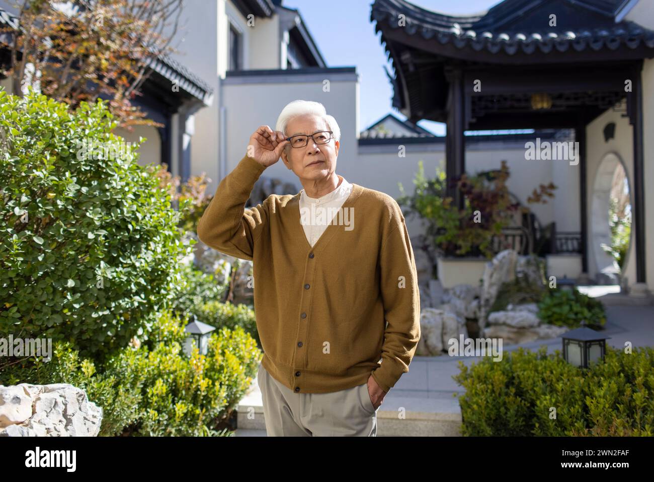 Senior Man in Classical Garden Stock Photo