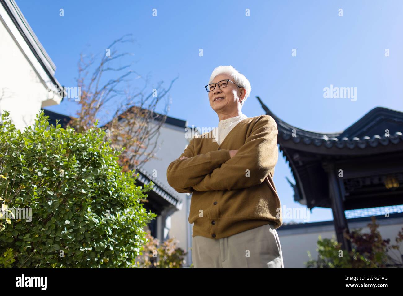 Senior Man in Classical Garden Stock Photo