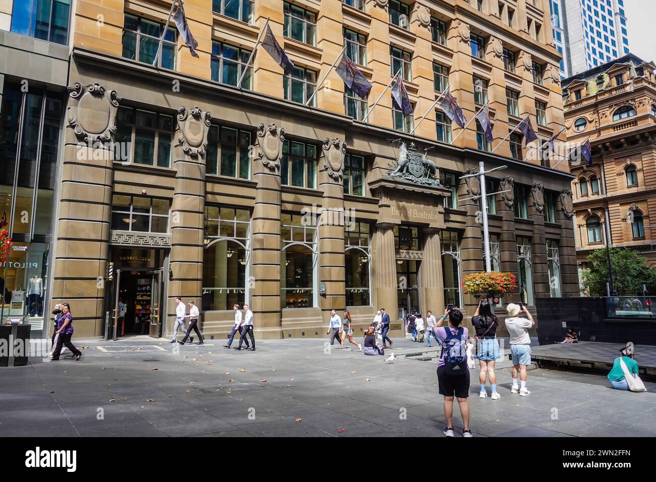 The Commonwealth Bank of Australia building in Sydney, Australia, attracts tourists who are captivated by its architectural grandeur and historical si Stock Photo