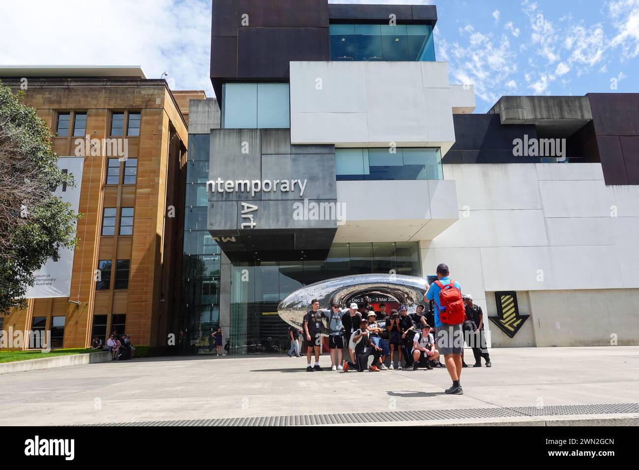 group of tourists taking photo in front of museum of contemporary art, sydney, australia Stock Photo