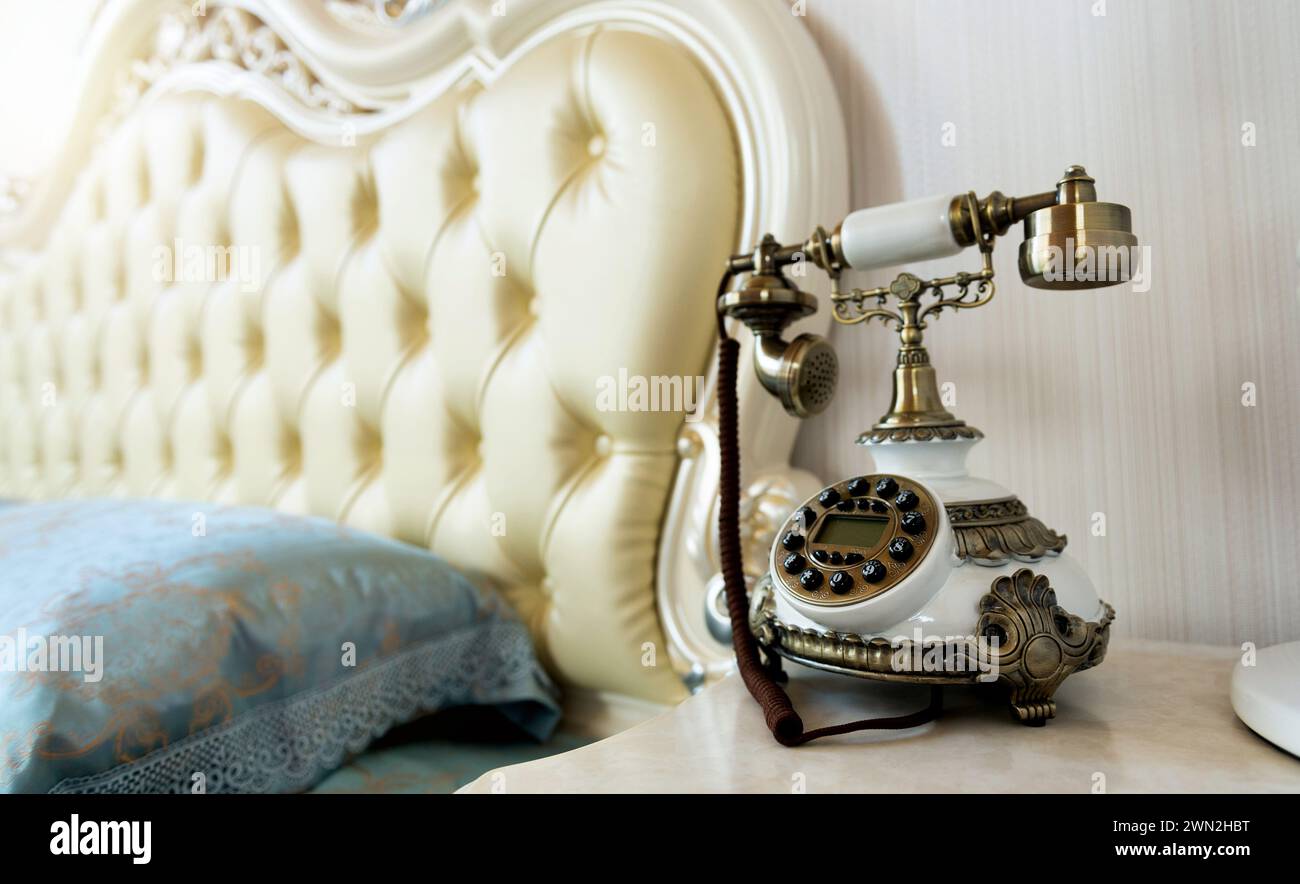 Luxury bedroom interior with vintage telephone on beside table Stock ...