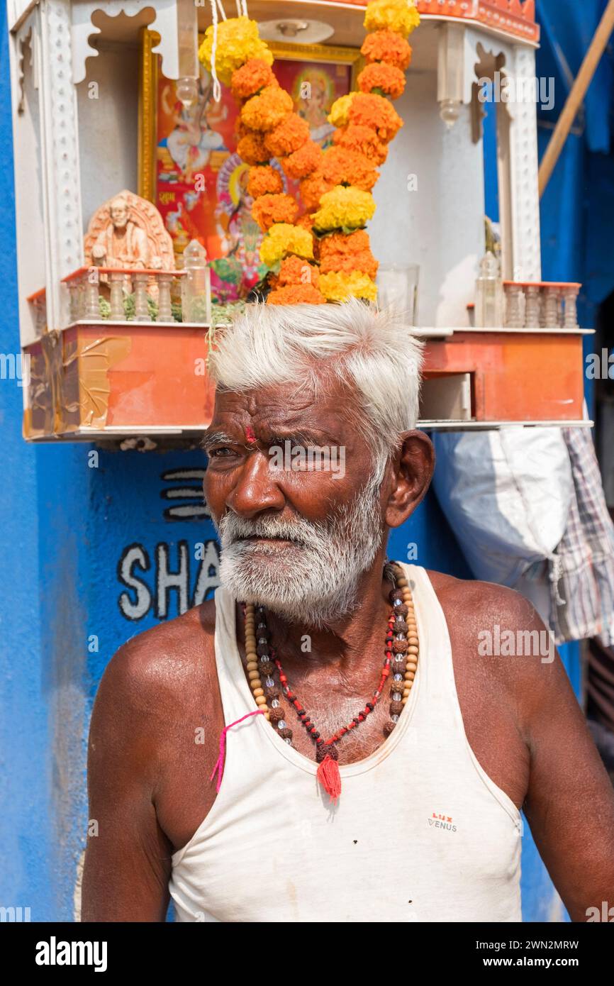 Man and shrine Sassoon Dock Mumbai Bombay Maharashtra India Stock Photo