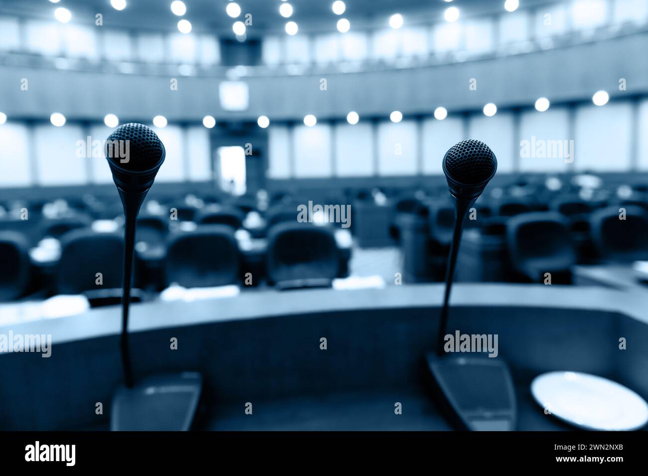 The microphones in front of empty chairs Stock Photo - Alamy
