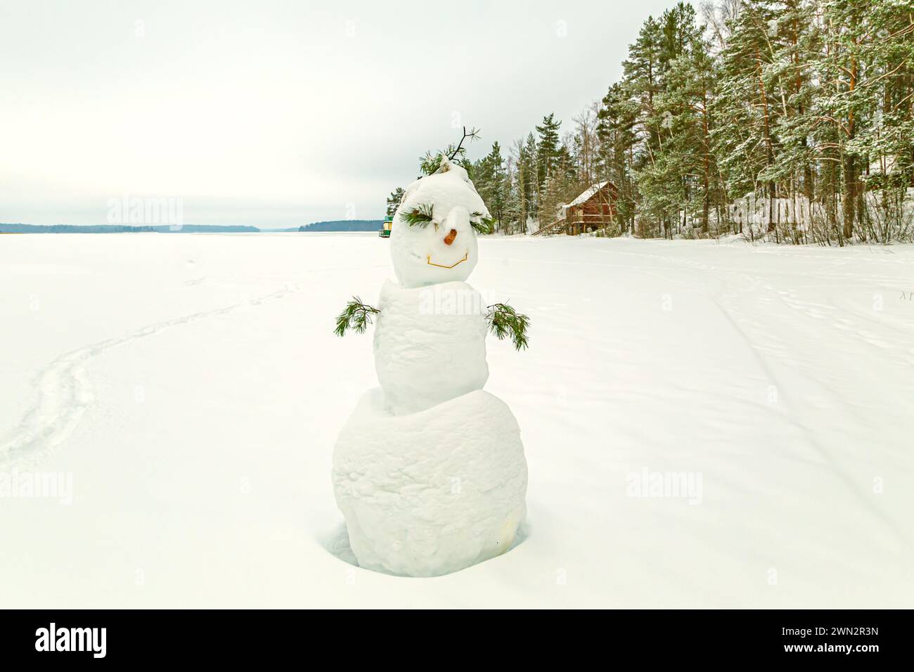 Funny snowman with a field. Symbol of winter, winter fun. Stock Photo