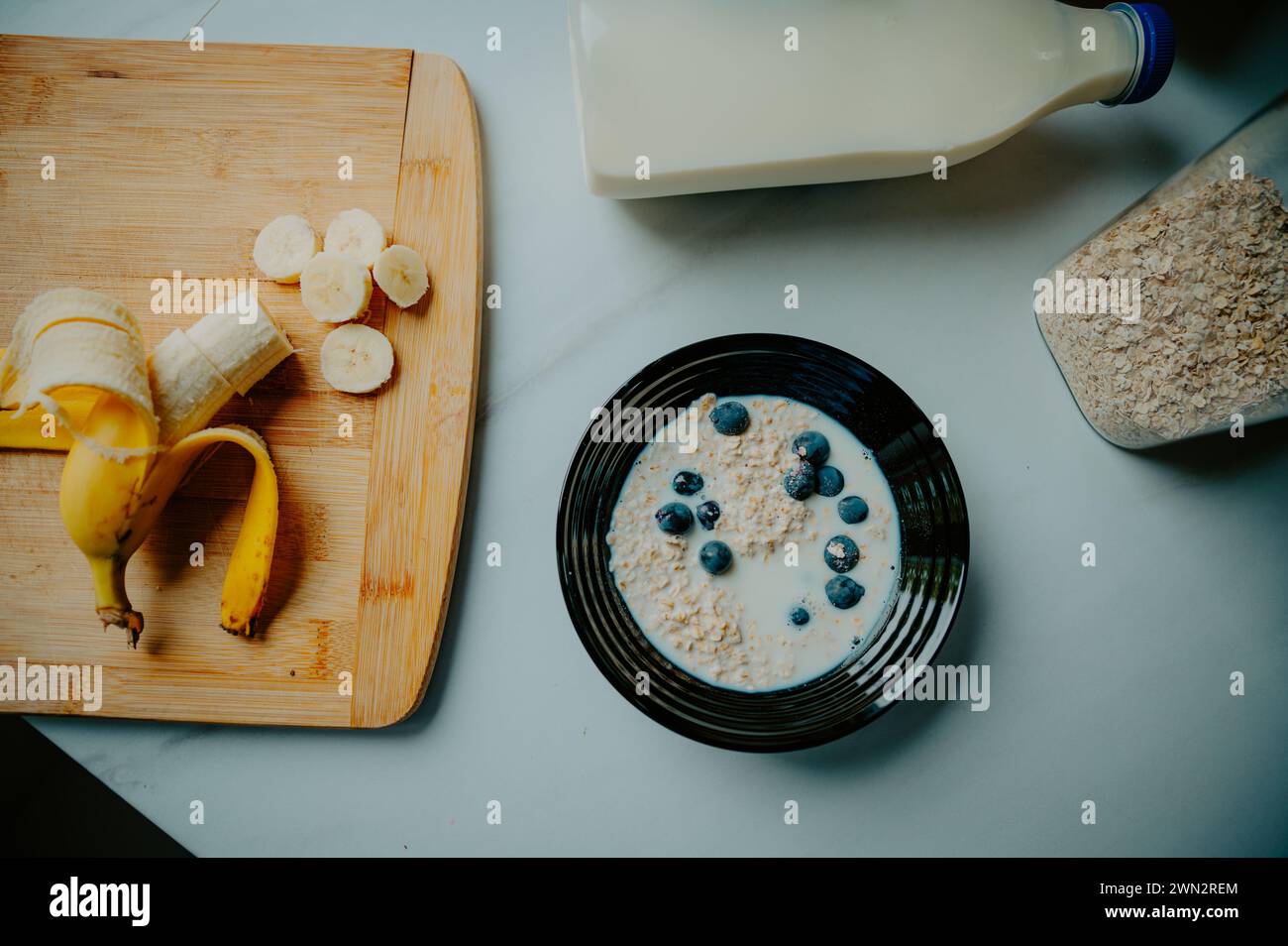 Sunlit goodness: A breakfast ensemble with banana and bread, a source of vitamins and fiber Stock Photo