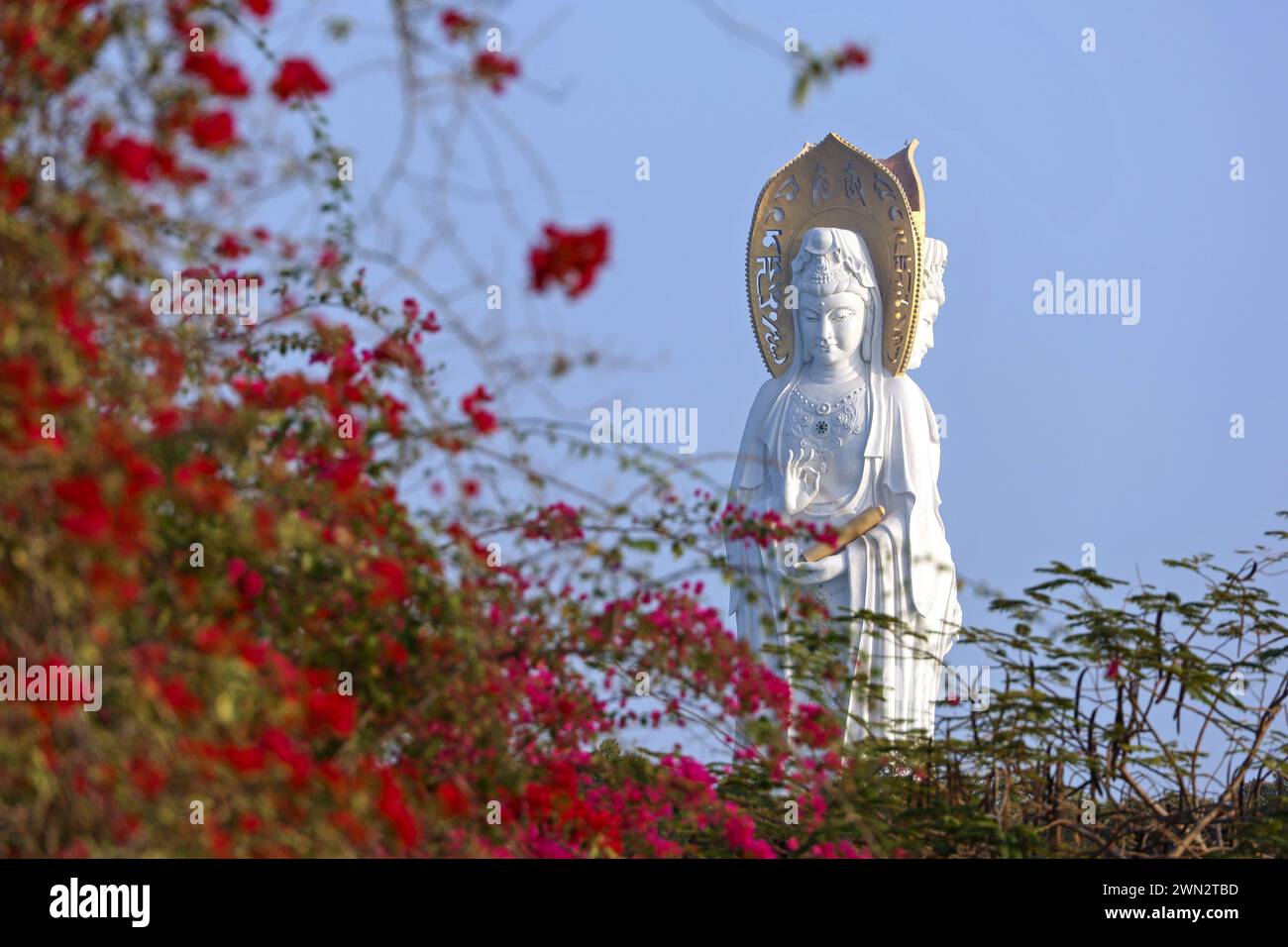 Statue of the goddess Guanyin on the territory of Nanshan buddhist culture park Stock Photo