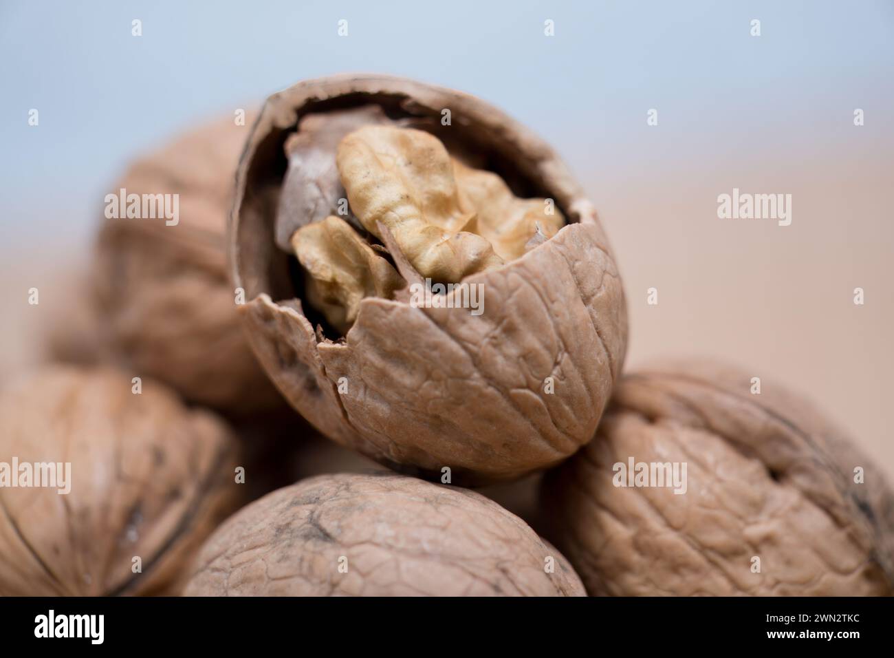 Golden Kernel Revealed: A Close-Up of Cracked Walnut Amidst Others ...
