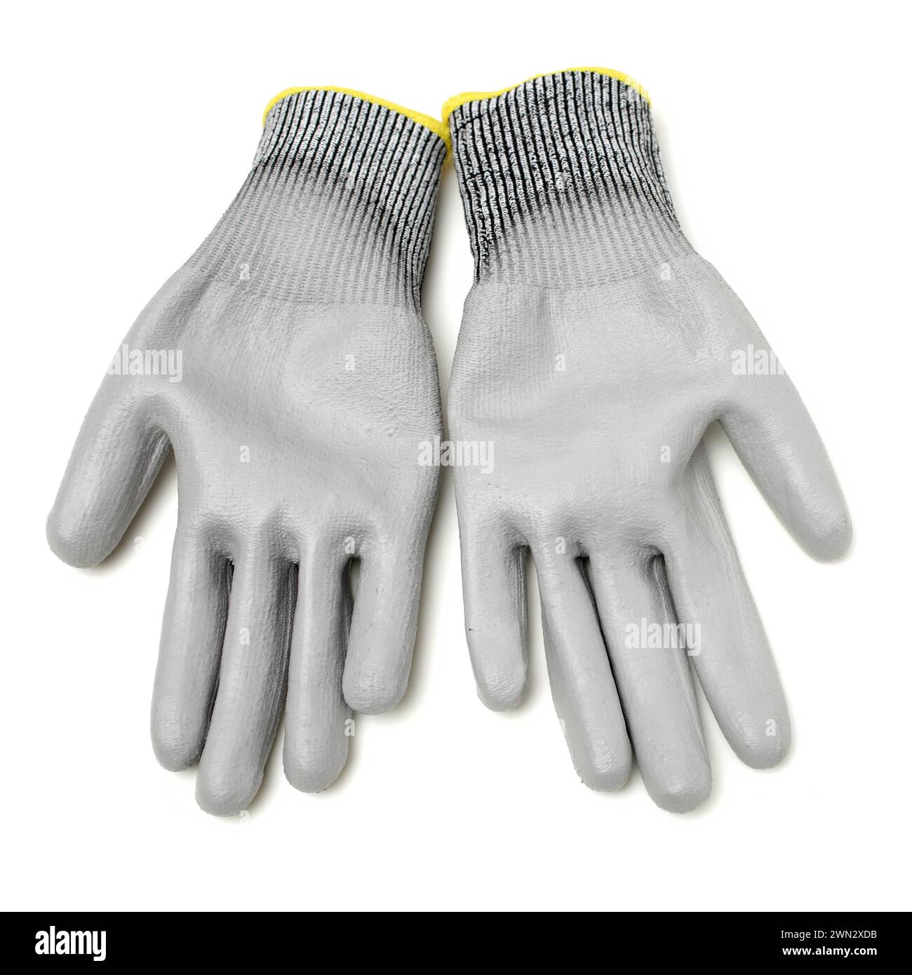 Pair of gray textile work gloves with protective rubber layer isolated on white background with soft shadow Stock Photo