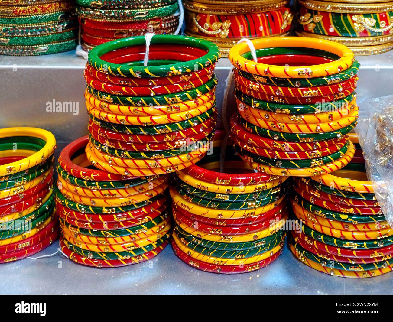 Indian colorful bangles displayed in local shop in a market of Pune, India, These beautiful bangles are made of Glass used as beauty accessories by In Stock Photo