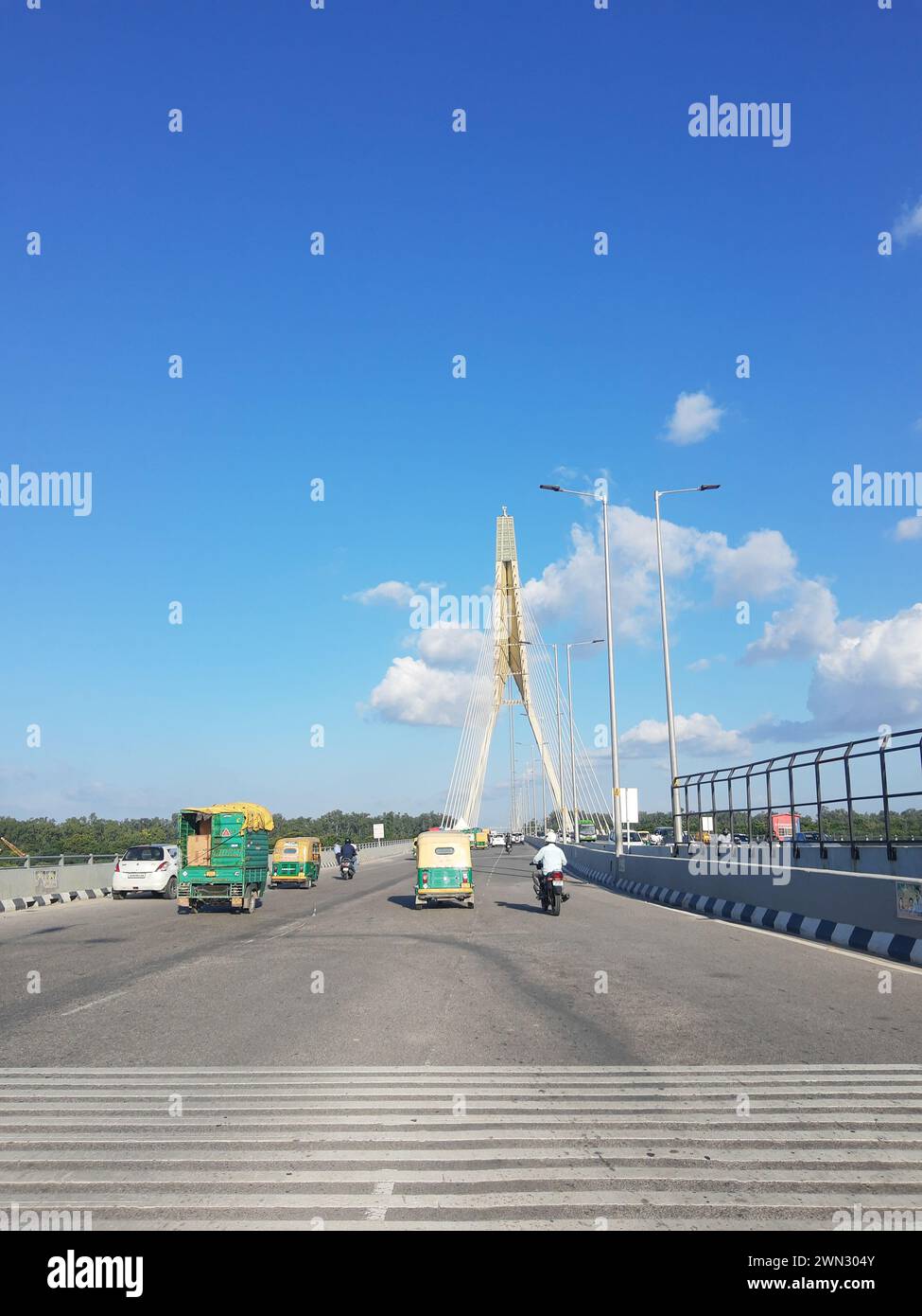 The traffic on a bridge during daylight in Delhi Stock Photo