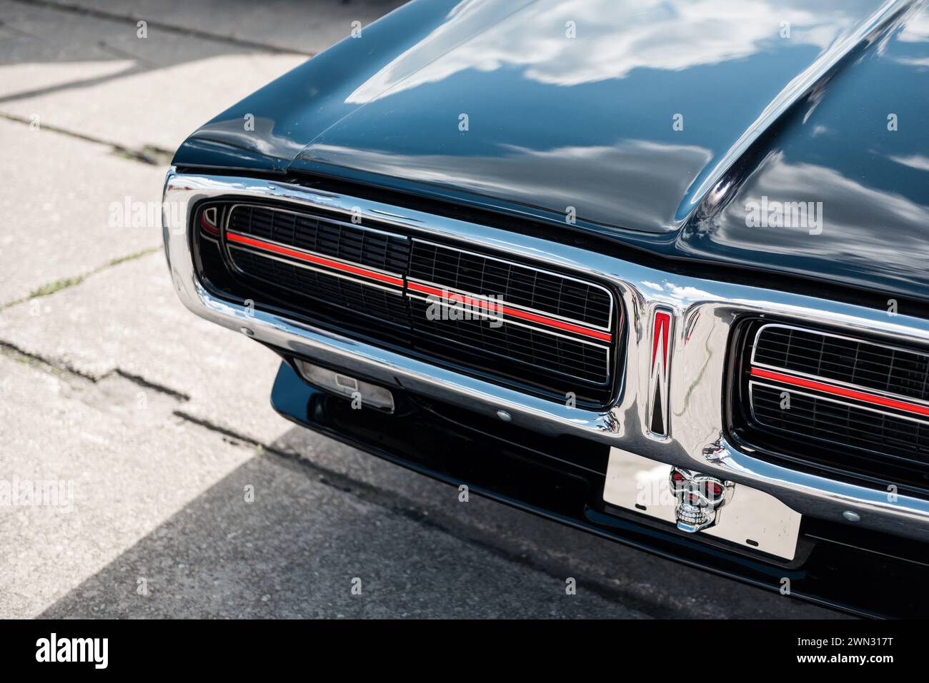 Front Of Black 1972 Dodge Charger Close Up Shot Of Muscle Car With Chrome Trim Headlight