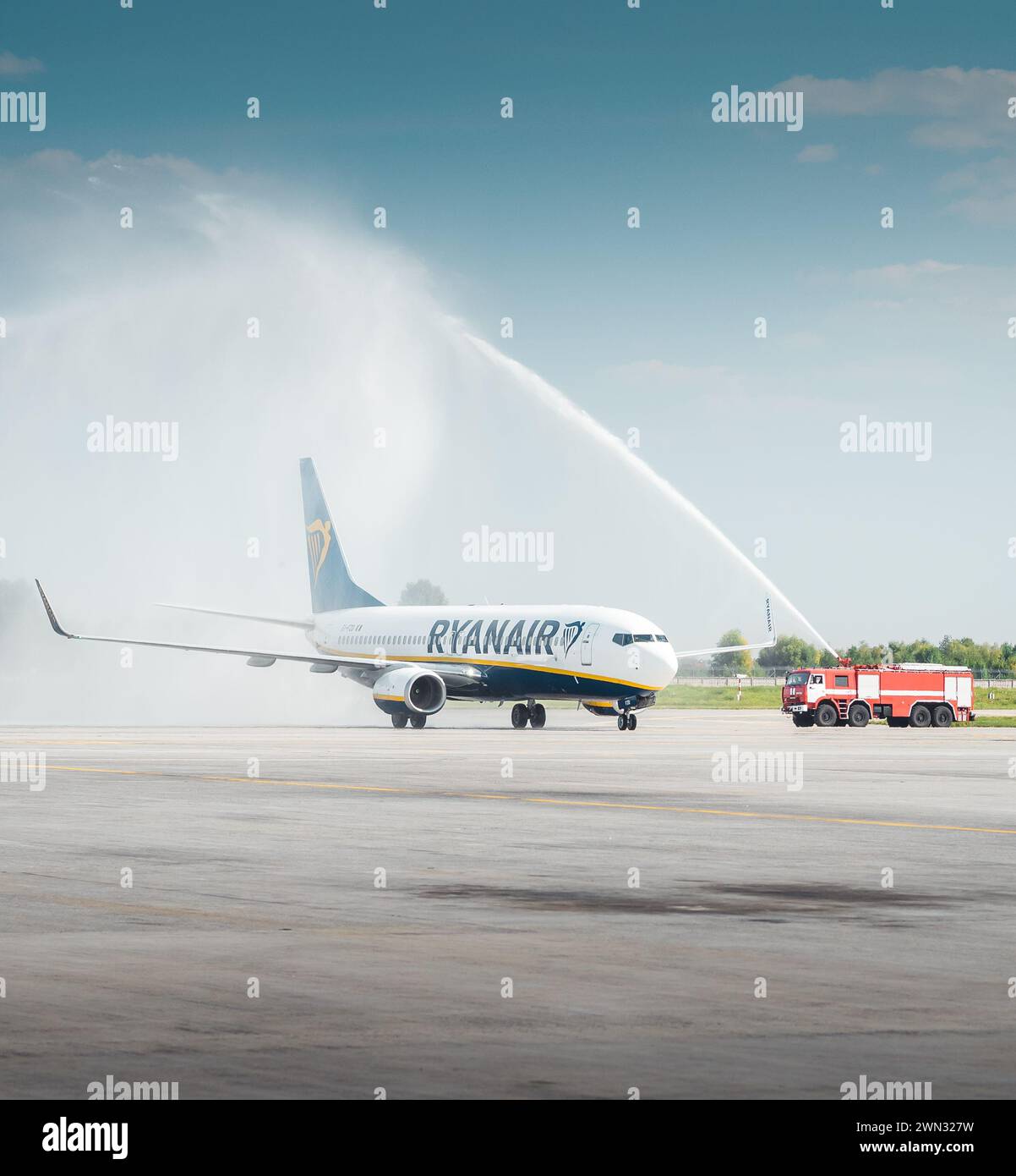 Water salute for the commencement of RyanAir service at Boryspil International Airport. Airplane Boeing 737 (EI-FZD) passing under water arch Stock Photo