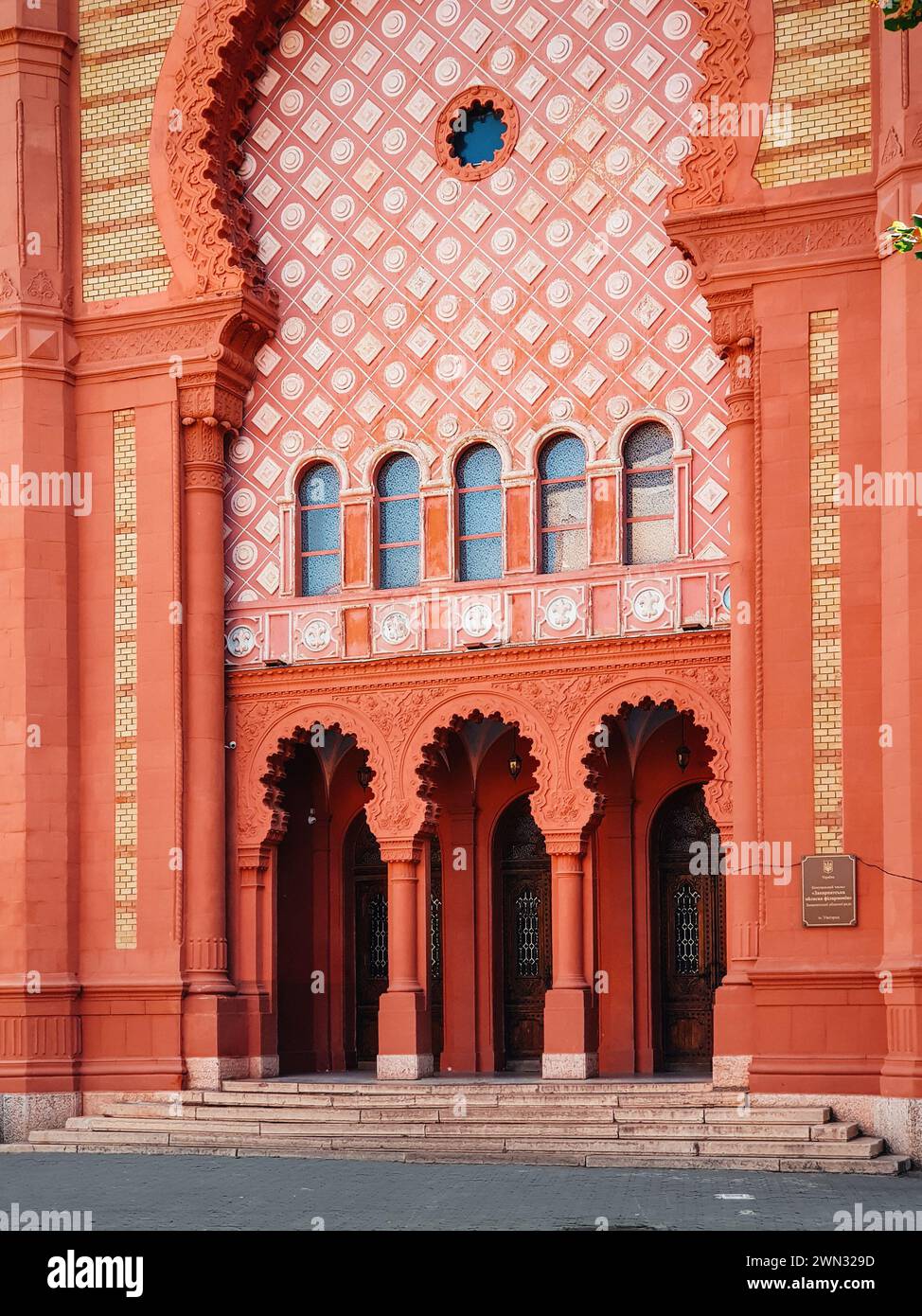entrance to Uzhhorod Synagogue. Clay colored building of early 20th century in style of Romantic architecture with Moorish and Byzantin Revival Stock Photo