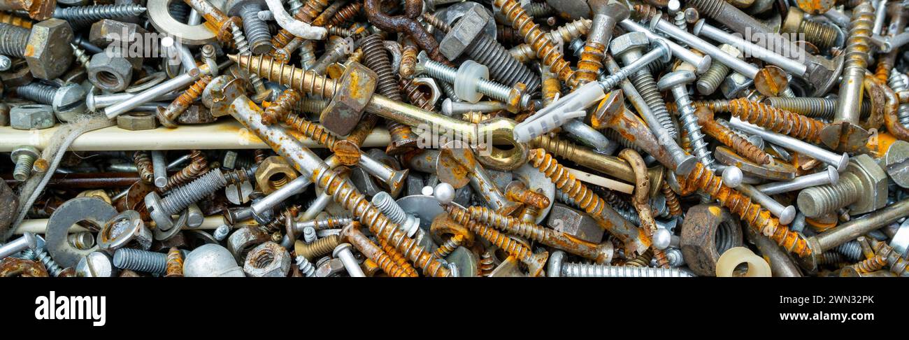 Panorama Rusty screws, nuts and nails Stock Photo
