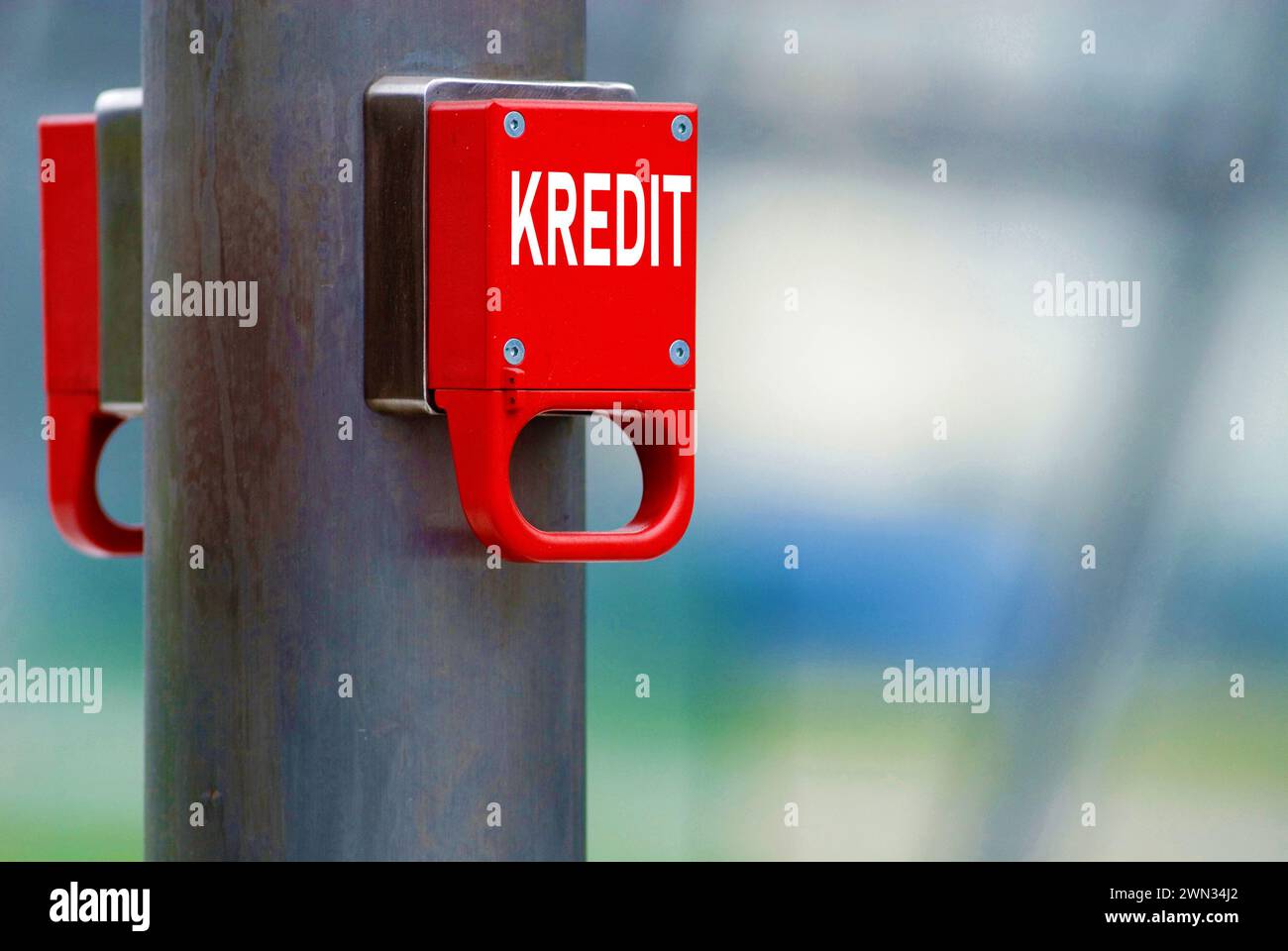 red emergency brake marked with german word Kredit for Credit, debt, ceiling, mountain, pile, reduction, burden Stock Photo