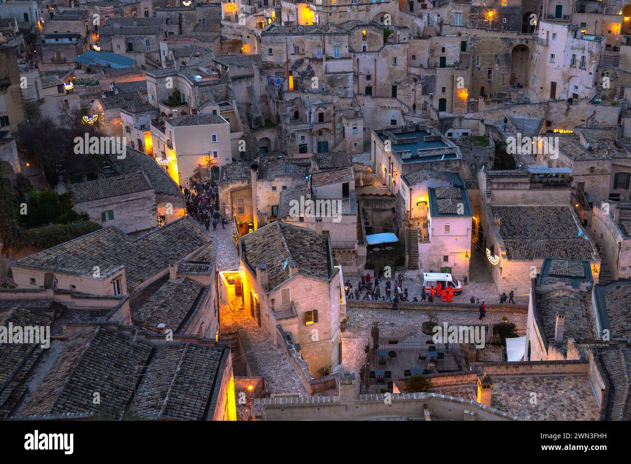 Arial view of Matera sassi at sunset with street light on, Italy Stock Photo