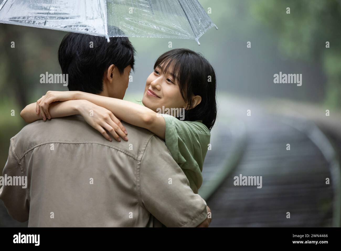 Young couple holding umbrella Stock Photo