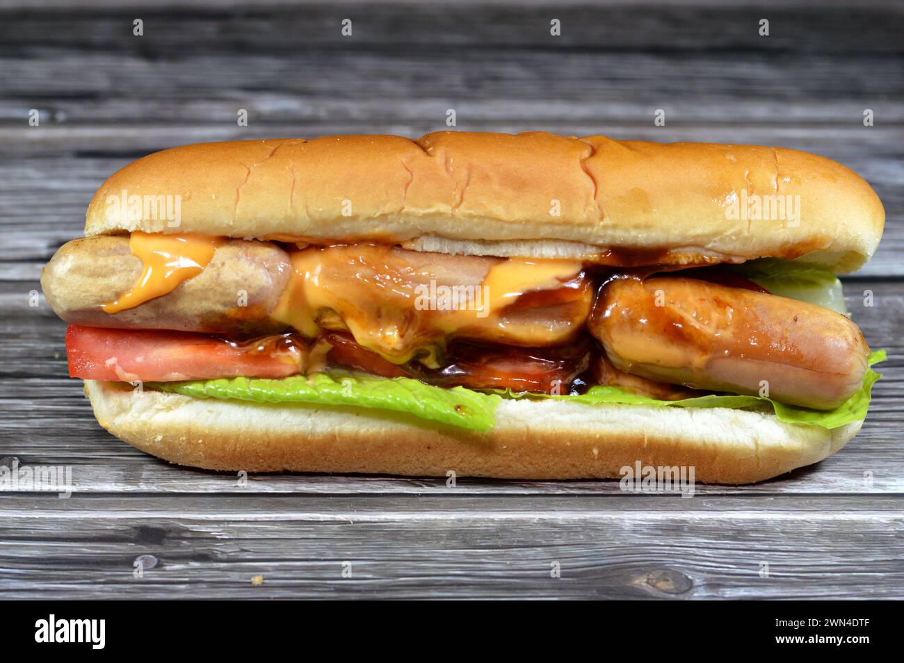 chicken hot dog with thousand island dressing sauce of ketchup