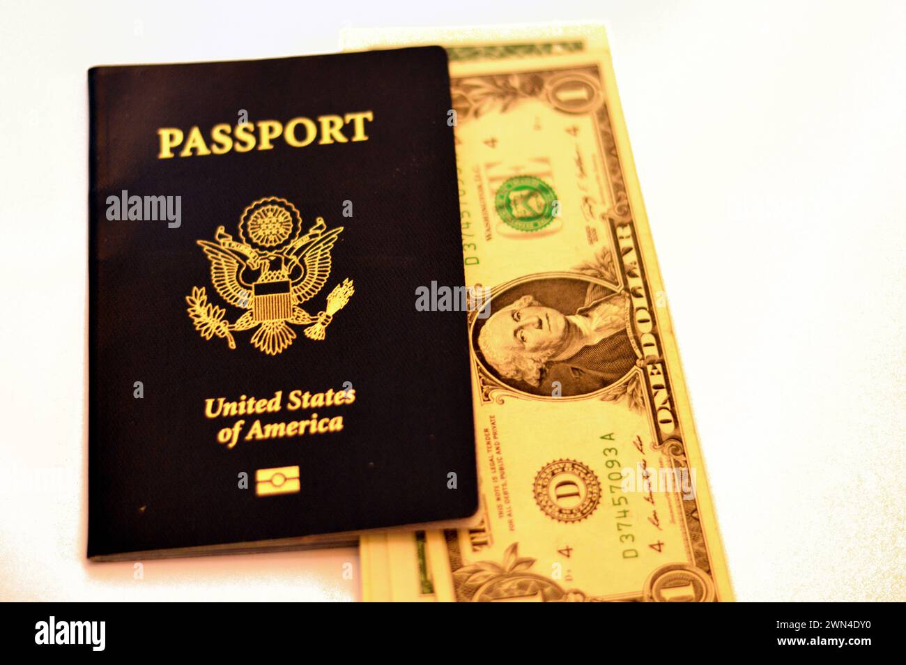 USD American dollars with The United States of American passport, passports are issued to the American citizens and nationals, Travel, tourism concept Stock Photo