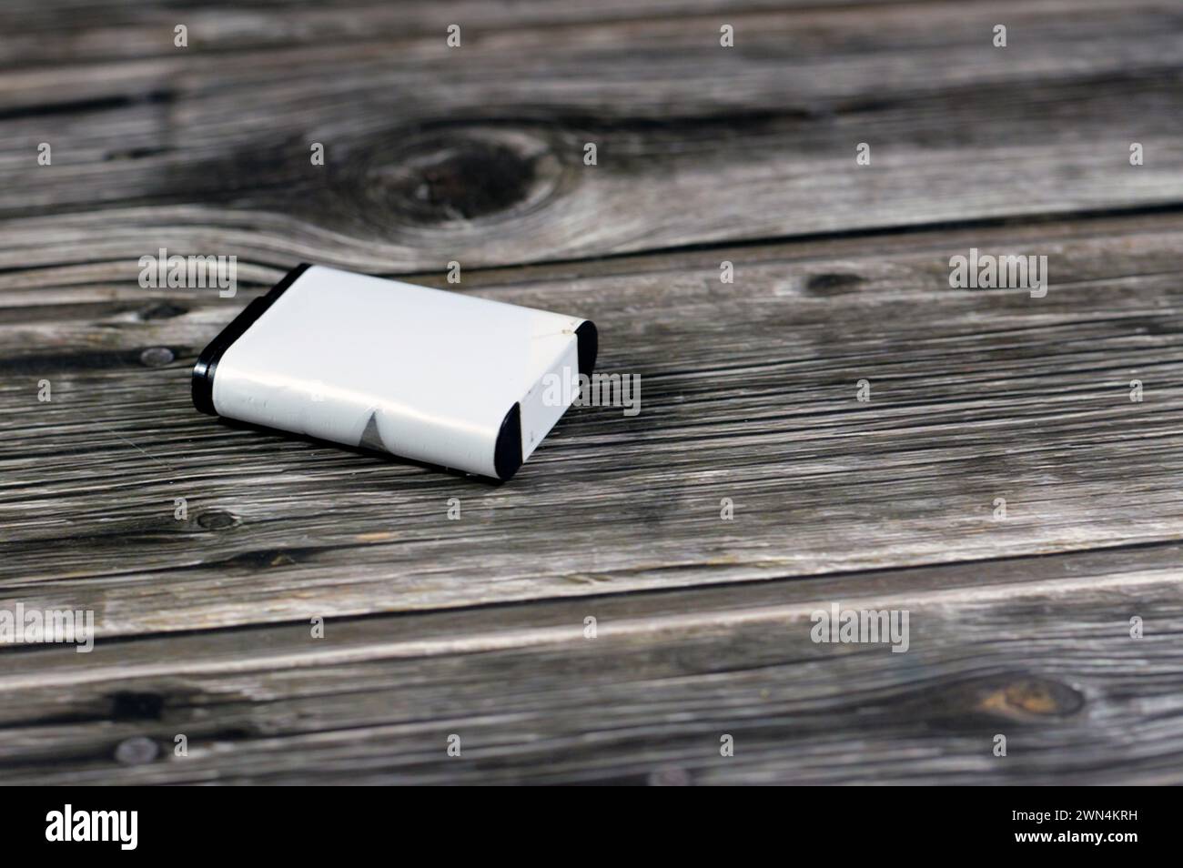 Bloated lithium ion batteries, possibly damaged by faulty monitoring electronics, swollen inflated battery damage, bloated rechargeable secondary cell Stock Photo