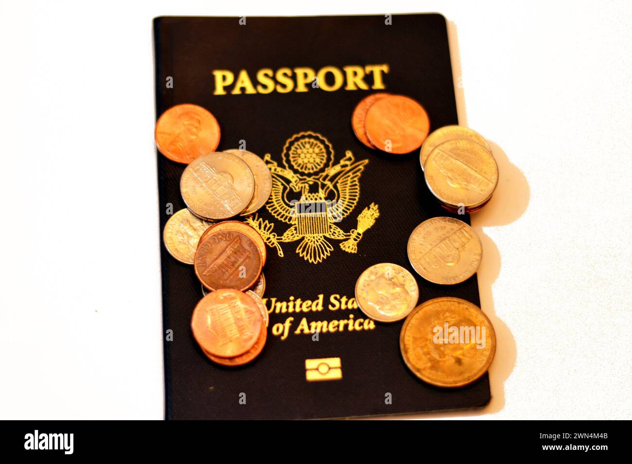 American coins change on the United States of American passport, passports are issued to the American citizens and nationals, Travel, tourism concept, Stock Photo